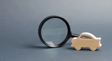 Model car with a magnifying glass